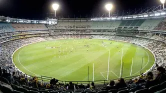 AFL oval field with distinctive goal posts and playing surface